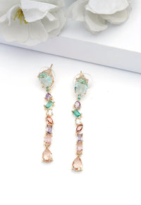 Boucles d'oreilles longues à pompons multicolores